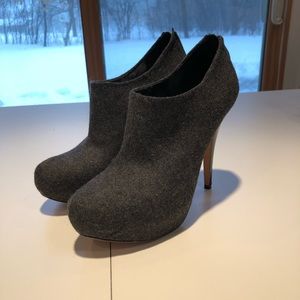 Stiletto heeled gray flannel booties.